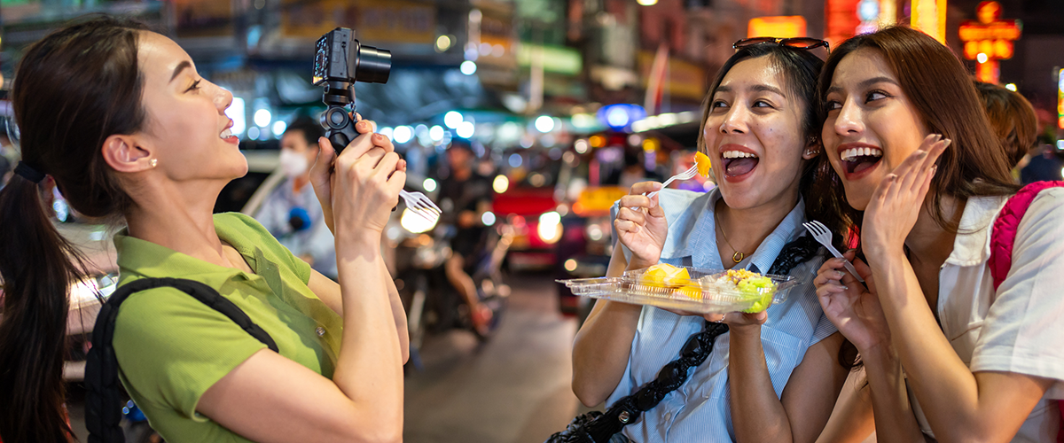 Two people sharing a genuine moment of laughter at a local market